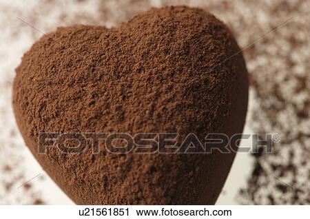 Stock Image - Chocolate heart covered in cocoa powder. Fotosearch
