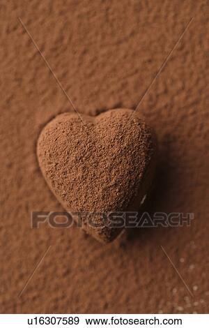 Stock Photo - Chocolate heart covered in cocoa powder. Fotosearch