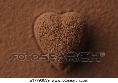 Stock Photo - Chocolate heart covered in cocoa powder. Fotosearch