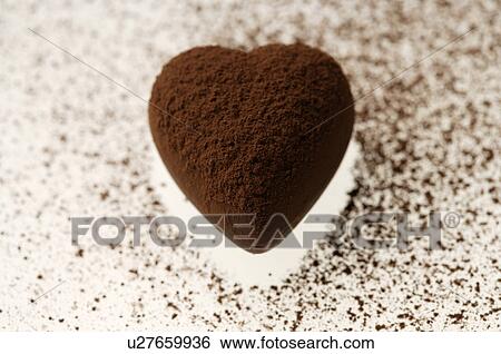Stock Photograph - Chocolate heart covered in cocoa powder. Fotosearch