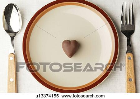Chocolate heart on a plate View Large Photo Image Stock Photography - Chocolate heart on a plate. Fotosearch