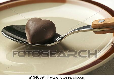 Chocolate heart on a spoon View Large Photo Image Picture - Chocolate heart on a spoon. Fotosearch
