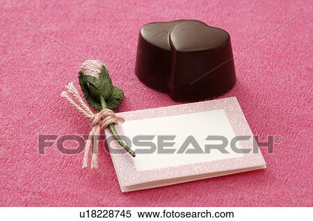 Chocolate hearts and a pink gift tag View Large Photo Image Stock Photography - Chocolate hearts and a pink gift tag. Fotosearch