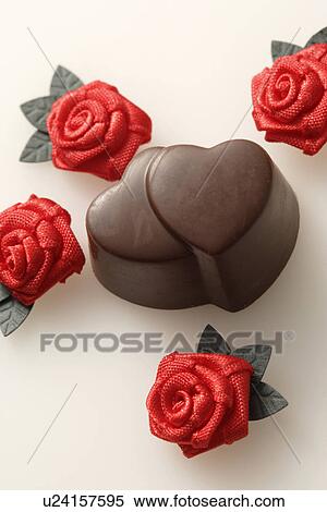 Chocolate hearts surrounded by decorative roses View Large Photo Image Stock Photography - Chocolate hearts surrounded by decorative roses. Fotosearch