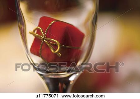 Christmas ornament in a wine glass View Large Photo Image Stock Image - Christmas ornament in a wine glass. Fotosearch
