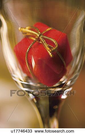 Christmas ornament in a wine glass View Large Photo Image Stock Image - Christmas ornament in a wine glass. Fotosearch