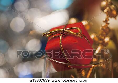 Stock Photo - Christmas ornament in a wine glass. Fotosearch