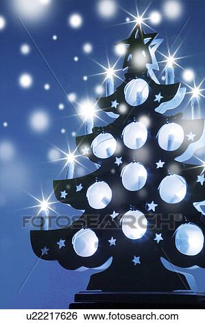 Stock Photograph - Christmas tree with candles. Fotosearch