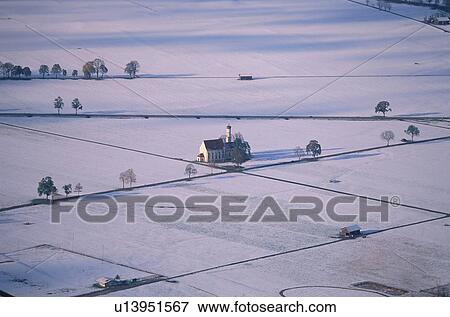 Church surrounded by snow covered farmland, Germany View Large Photo Image Stock Photo - Church surrounded by snow covered farmland, Germany. Fotosearch