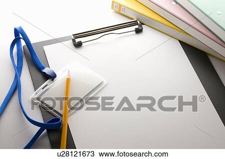Clipboard with ID tag, pencil and folders View Large Photo Image Stock Image - Clipboard with ID tag, pencil and folders. Fotosearch