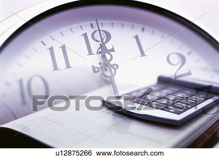 Stock Photograph - Clock and a calculator. Fotosearch