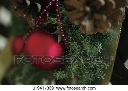 Close-up of baubles in a Christmas tree View Large Photo Image Stock Photo - Close-up of baubles in a Christmas tree. Fotosearch