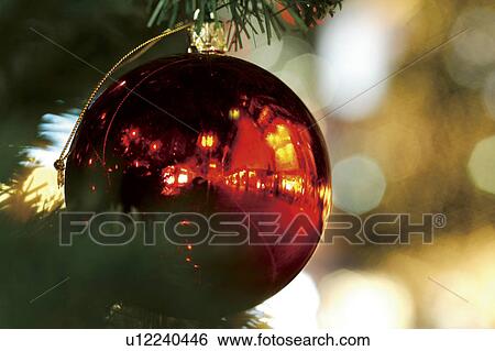 Stock Photograph - Close-up of baubles in a Christmas tree. Fotosearch
