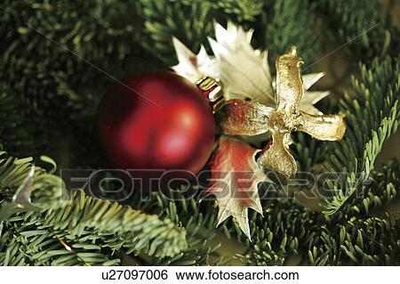 Stock Photograph - Close-up of baubles in a Christmas tree. Fotosearch