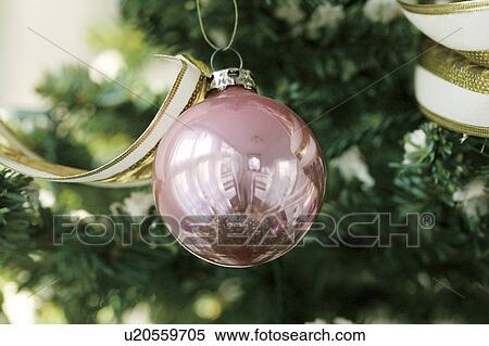 Stock Photography - Close-up of baubles in a Christmas tree. Fotosearch