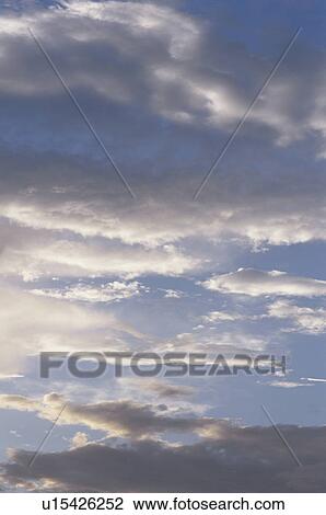 Stock Image - Clouds at sunset. Fotosearch