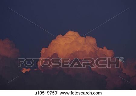 Stock Photo - Clouds at sunset. Fotosearch