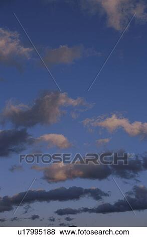 Stock Photo - Clouds at sunset. Fotosearch