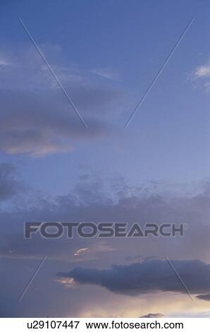 Stock Photo - Clouds at sunset. Fotosearch