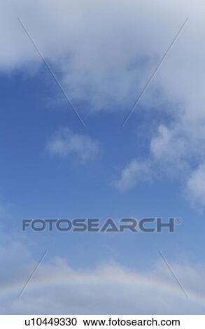 Stock Image - Clouds in a blue sky. Fotosearch