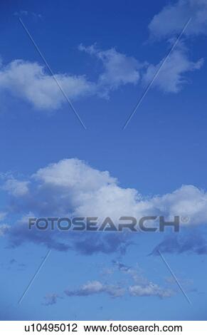 Clouds in a blue sky View Large Photo Image Stock Image - Clouds in a blue sky. Fotosearch