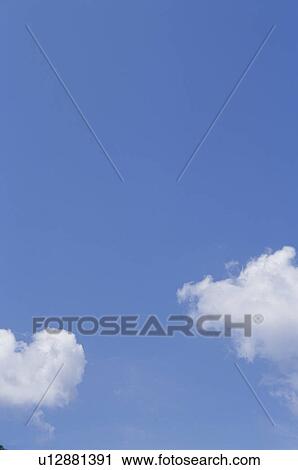 Clouds in a blue sky View Large Photo Image Stock Image - Clouds in a blue sky. Fotosearch