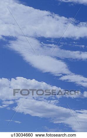 Stock Image - Clouds in a blue sky. Fotosearch