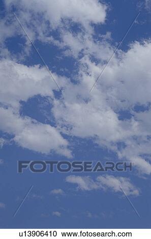 Stock Image - Clouds in a blue sky. Fotosearch