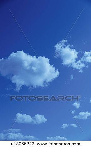 Stock Image - Clouds in a blue sky. Fotosearch