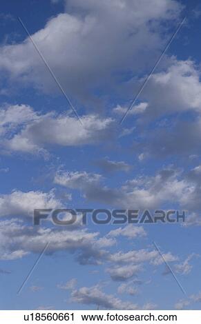 Stock Image - Clouds in a blue sky. Fotosearch