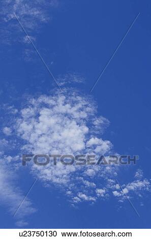 Clouds in a blue sky View Large Photo Image Stock Image - Clouds in a blue sky. Fotosearch