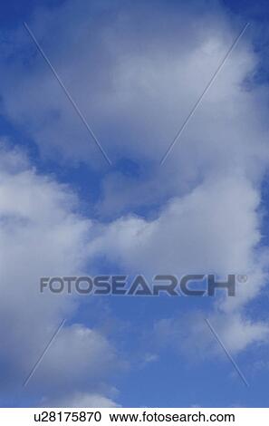 Clouds in a blue sky View Large Photo Image Stock Image - Clouds in a blue sky. Fotosearch