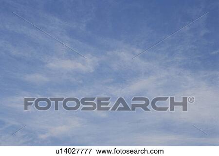 Clouds in a blue sky View Large Photo Image Stock Photo - Clouds in a blue sky. Fotosearch