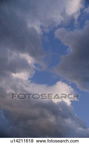 Stock Photo - Clouds in a blue sky. Fotosearch