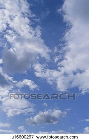Clouds in a blue sky View Large Photo Image Stock Photo - Clouds in a blue sky. Fotosearch