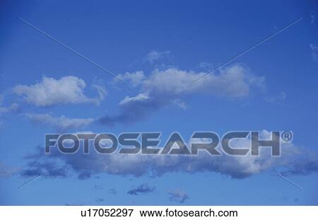 Stock Photo - Clouds in a blue sky. Fotosearch