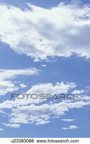 Clouds in a blue sky View Large Photo Image Stock Photo - Clouds in a blue sky. Fotosearch