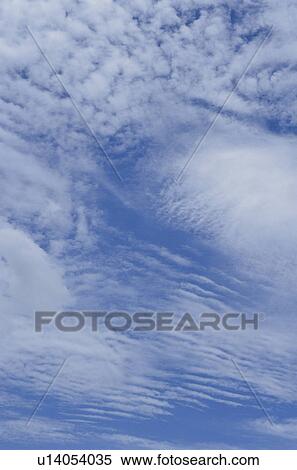 Clouds in a blue sky View Large Photo Image Stock Photography - Clouds in a blue sky. Fotosearch