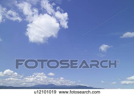 Stock Photo - Clouds in blue sky. Fotosearch