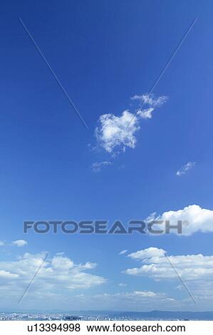 Stock Photo - Clouds in blue sky. Fotosearch