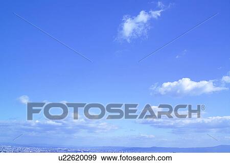 Stock Photo - Clouds in blue sky. Fotosearch