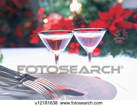 Stock Photo - Cocktails on table with plate, knife and forks. Fotosearch