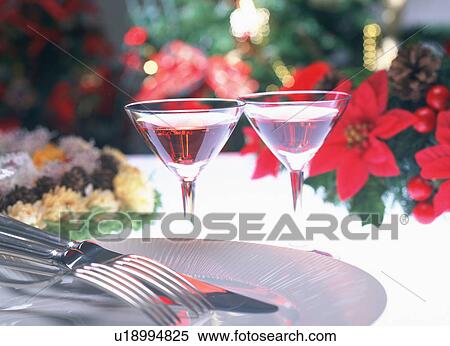 Stock Photography - Cocktails on table with plate, knife and forks. Fotosearch
