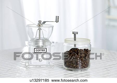 Stock Photography - Coffee beans and a coffee grinder. Fotosearch