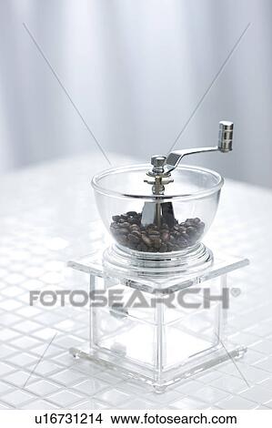 Coffee beans in a coffee grinder View Large Photo Image Picture - Coffee beans in a coffee grinder. Fotosearch