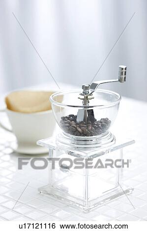 Coffee beans in a coffee grinder View Large Photo Image Stock Photograph - Coffee beans in a coffee grinder. Fotosearch