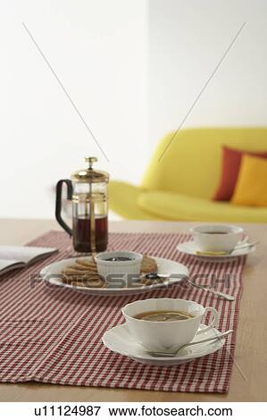 Coffee cup and cookies on table View Large Photo Image Stock Photo - Coffee cup and cookies on table. Fotosearch