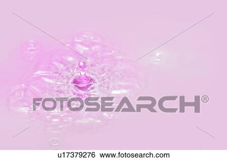 Stock Photograph - Colored liquid drops. Fotosearch