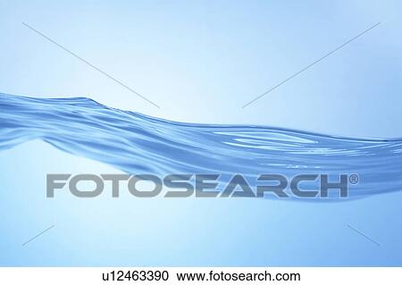 Stock Image - Cross section of water, close up, blue background. Fotosearch