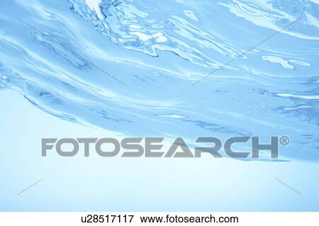 Stock Photo - Cross section of water, close up, blue background. Fotosearch